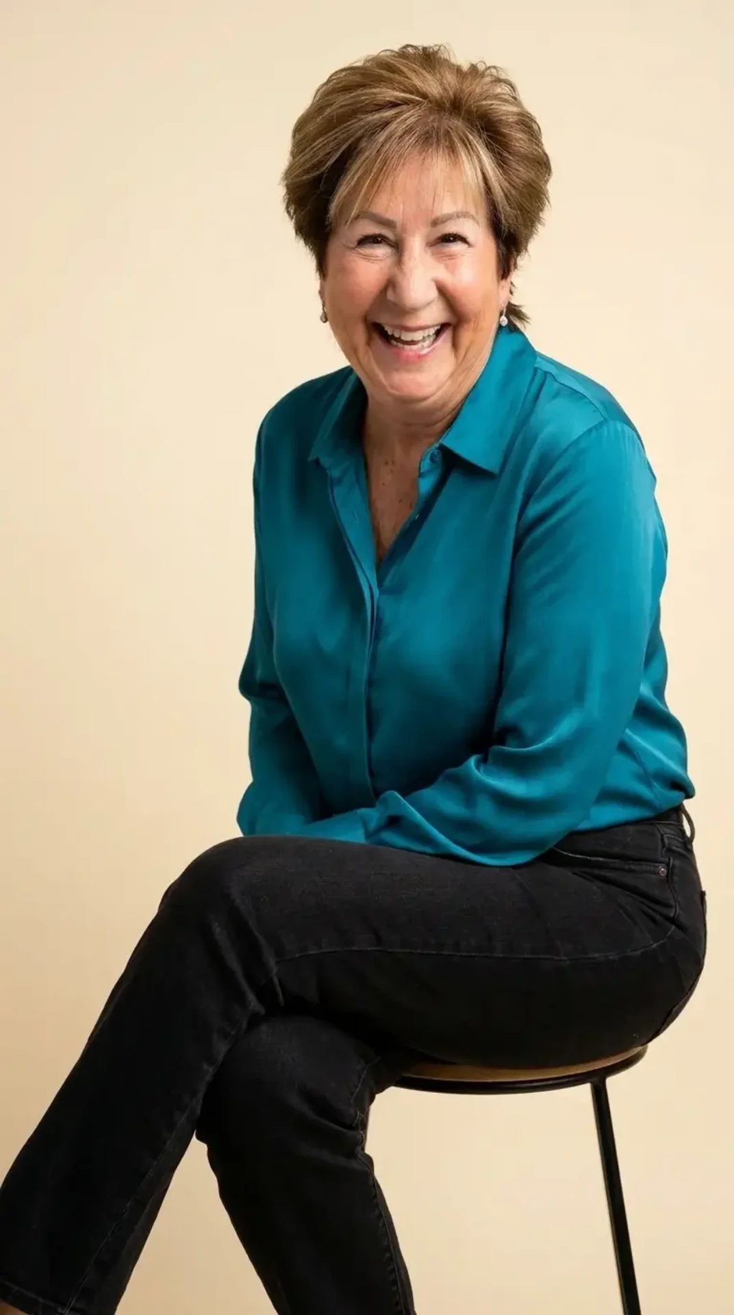 Ellen Scherr smiling in a teal blouse